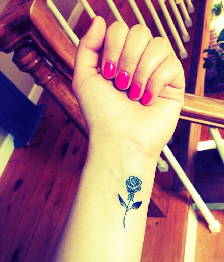 small rose tattoos on wrist