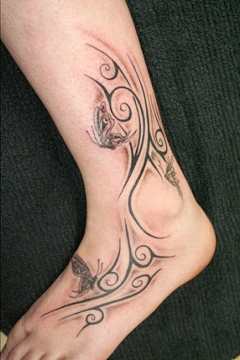 Tribal Tattoos tribal tattoos on foot of girls with butterflies