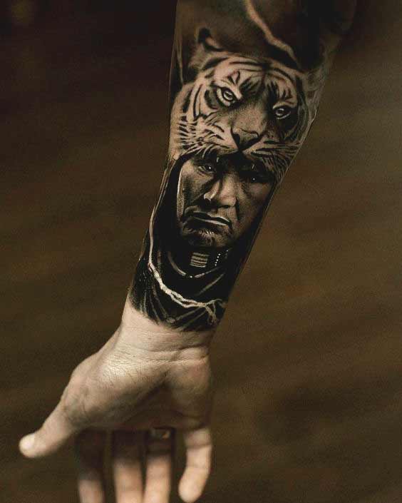 Best Tiger Tattoos For Men And Women Tiger with men face tattoo on inner forearm