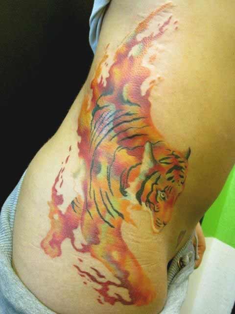 Best Tiger Tattoos For Men And Women Watercolor tiger tattoo on ribs ideas for girls