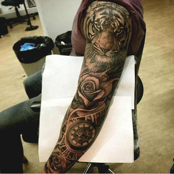 Best Tiger Tattoos For Men And Women Tiger tattoo on full arm with rose and compass designs for guys