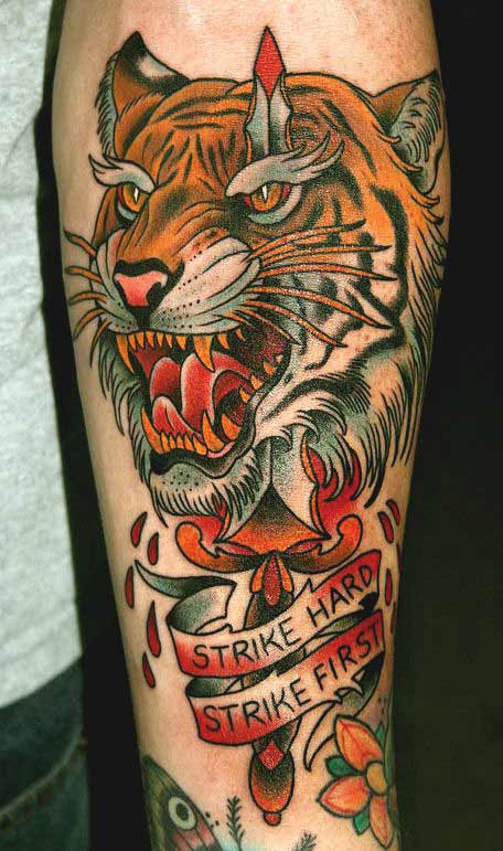 Japanese tiger face tattoo with quote on inner forearm Japanese tiger face tattoo with quote on inner forearm