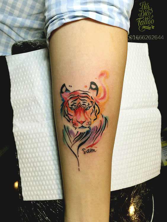 Best Tiger Tattoos For Men And Women Small watercolor tiger face tattoo on inner arm