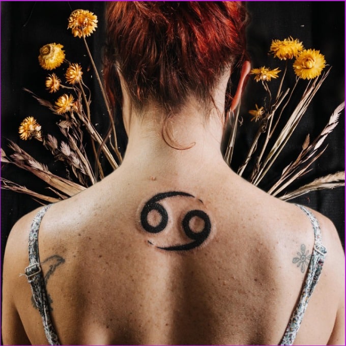 cancer zodiac tattoo on back