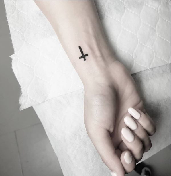 tiny cross wrist tattoo