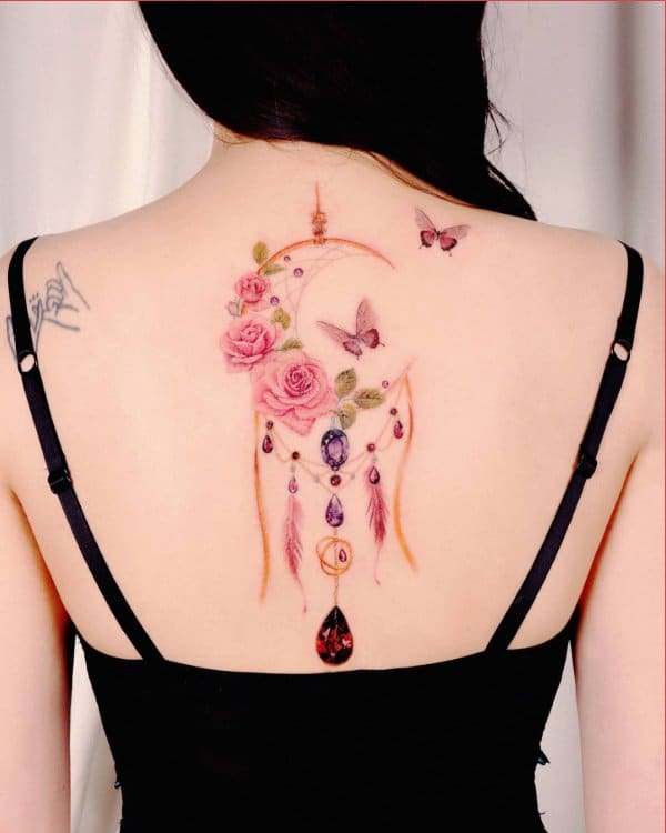 dream catcher tattoo upper back