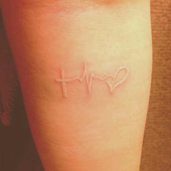 Best Faith Hope Love Tattoo Designs White ink faith hope and love tattoo symbols seems that they are present inside the skin