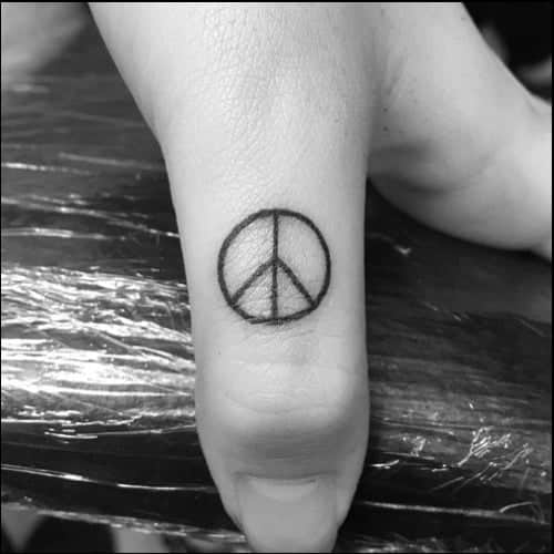 deathly hallow finger tattoo for men