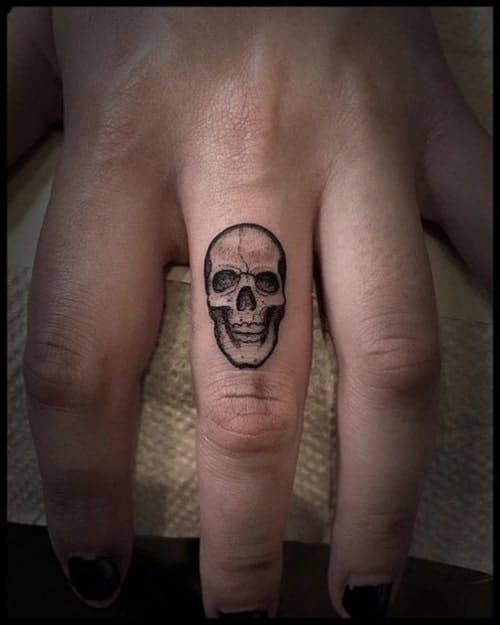 skull finger tattoos