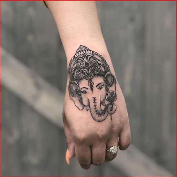 ganesha tattoo on wrist