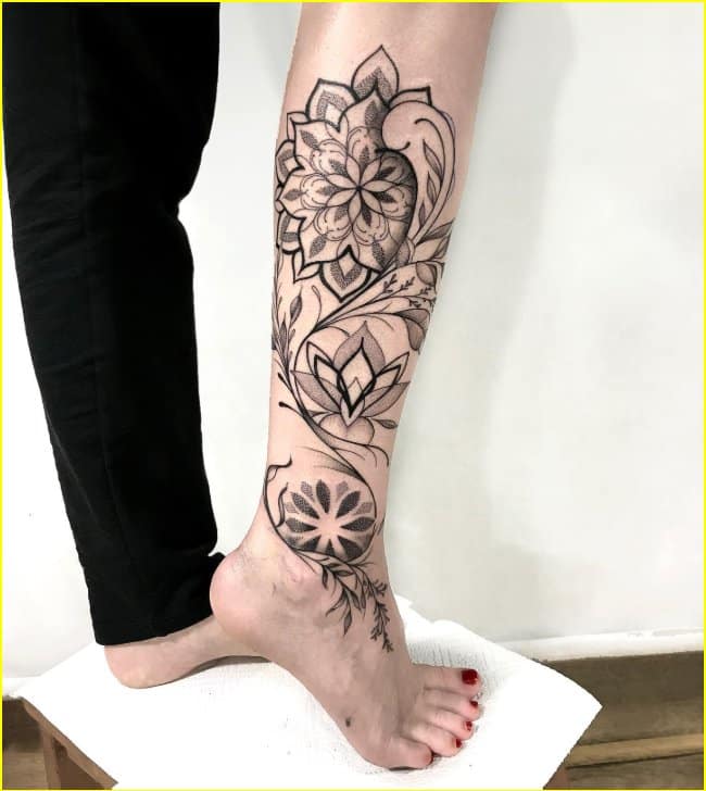 mandala tattoo with lotus flower on leg for women