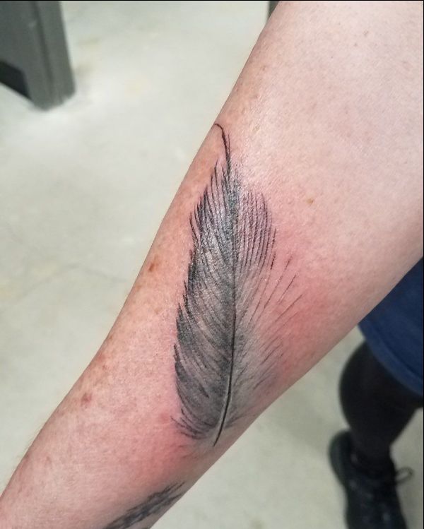 simple feather tattoo design