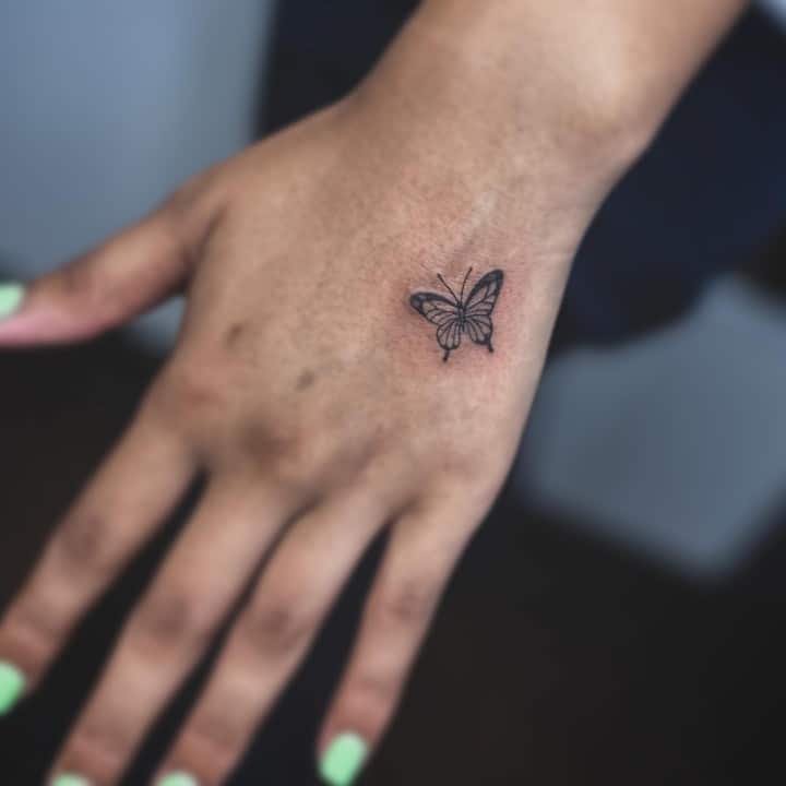 Hand Butterflies tattoo