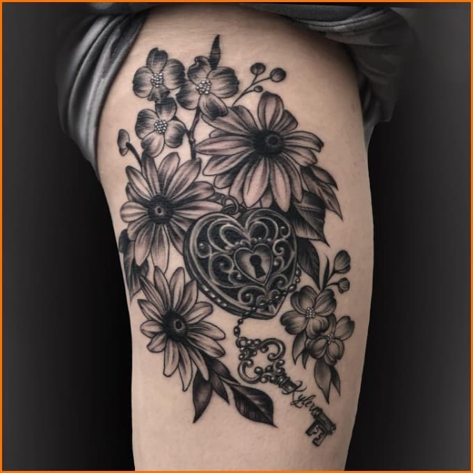 lock and key thigh tattoo