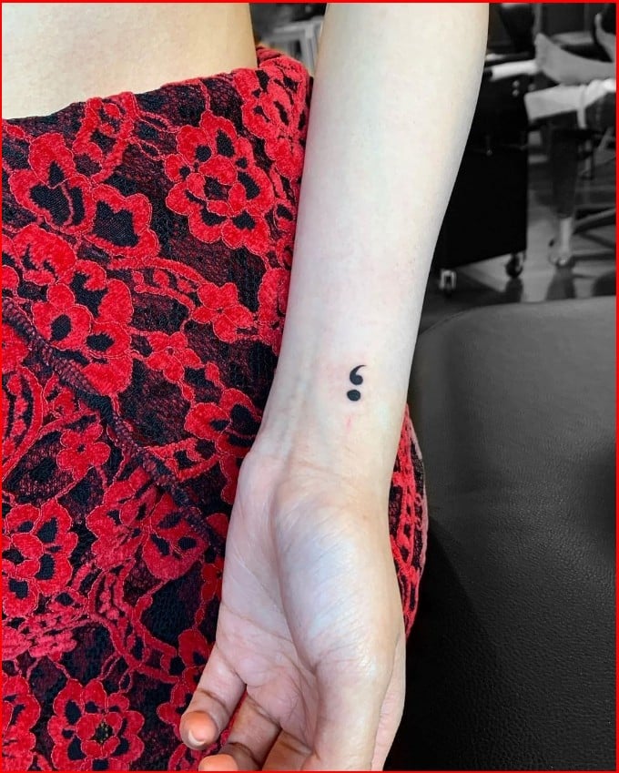 semicolon tattoo on wrist