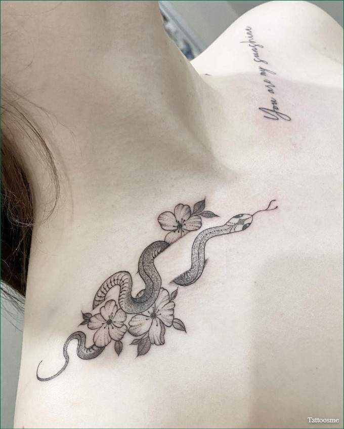 snake collarbone tattoo