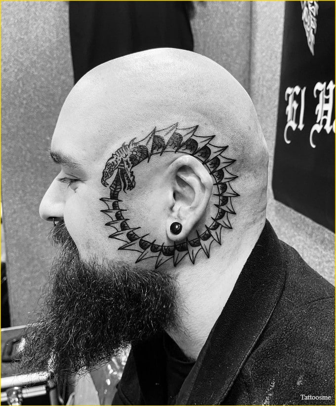 snake eating its tail tattoo